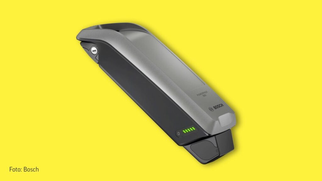 Bosch eBike Akku auf gelbem Hintergrund, zeigt Ladezustand und modernes Design.