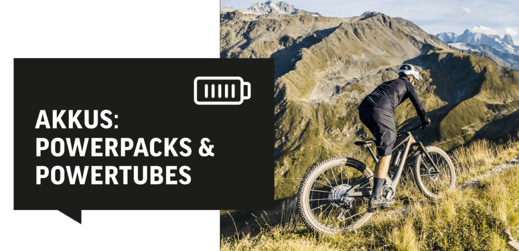 E-Bike-Fahrer in den Bergen, Fokus auf Akkus, Powerpacks und Powertubes für optimale Leistung und Reichweite.